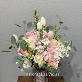Pink and white bouquet in a clear glass vase