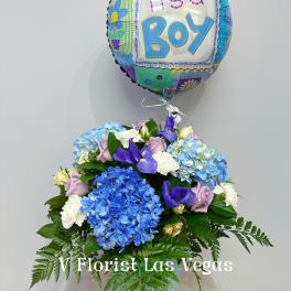 Blue hydrangea bouquet with a "It's a Boy" balloon