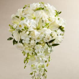 White cascading bouquet with lilies, roses, and orchids