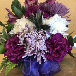 Purple and white mixed bouquet with a purple ribbon bow