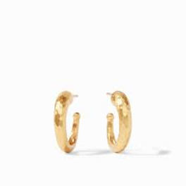 Pair of small textured gold hoop earrings on a white background