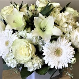White bouquet with lilies, roses, gerbera daisies, and hydrangea