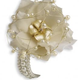Cream-colored floral accessory with pearl accents and gold wire