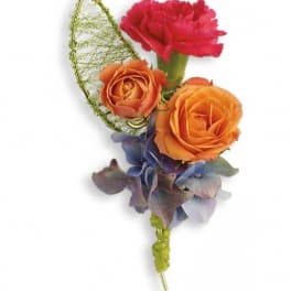 Boutonniere with orange and pink roses and blue hydrangea