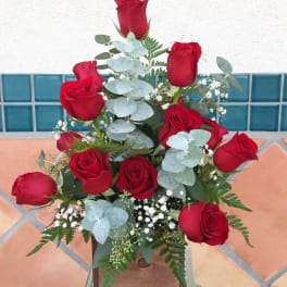 Bouquet of red roses with pale blue eucalyptus and baby's breath