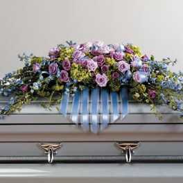 Lavender and blue tribute casket spray