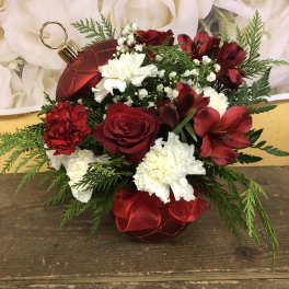 Red and white floral arrangement with ornament accents