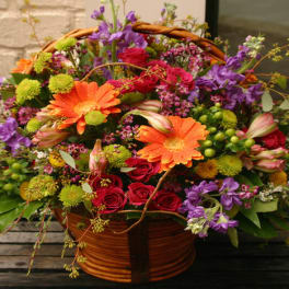 Colorful mixed flower basket with roses and gerbera daisies