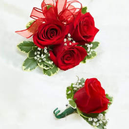 Red rose boutonniere and matching rose corsage with ribbon