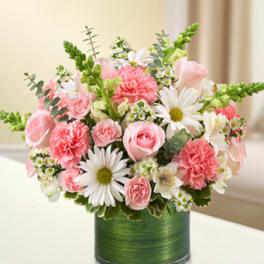 Pink and white bouquet in a green cylindrical vase
