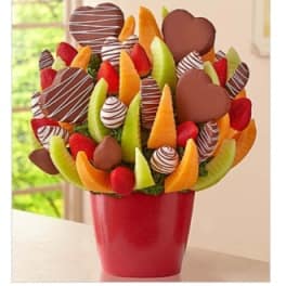 Chocolate-dipped fruit bouquet in a red container