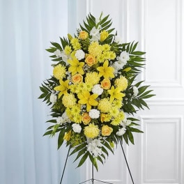 Yellow and white floral standing spray on an easel
