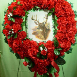 Heart-shaped red floral wreath with a deer picture in the center