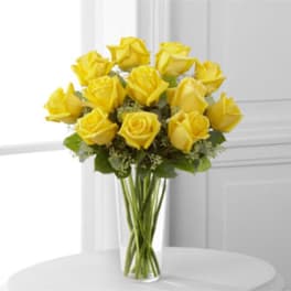 Bouquet of yellow roses in a clear glass vase