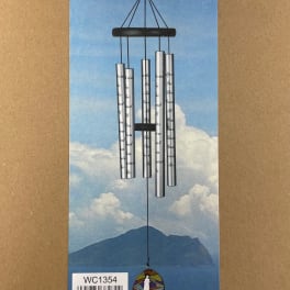 Silver wind chime hanging on a blue sky-themed card