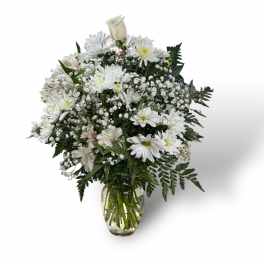 White floral bouquet in a clear glass vase