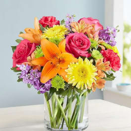 Colorful mixed bouquet in a clear glass vase