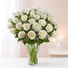 Bouquet of white roses in a clear glass vase