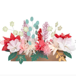 Paper flower arrangement in a brown box with pastel blooms and leaves