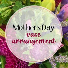 Mother's Day vase arrangement with pink, purple, and yellow flowers
