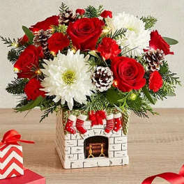 Christmas bouquet with red roses and white chrysanthemums in a decorative vase