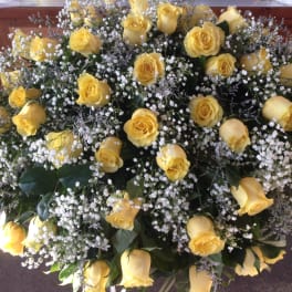 Large bouquet of yellow roses with white baby's breath