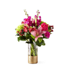 Pink and magenta mixed bouquet in a clear glass vase