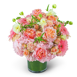 Pink and peach bouquet in a clear glass vase