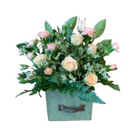 Peach roses and pink carnations in a mint-green box