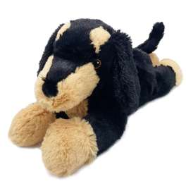Black and tan plush dog toy lying on a white background