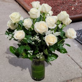 Bouquet of white roses in a clear glass vase