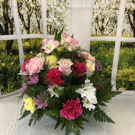 Mixed bouquet with pink, white, yellow, and purple flowers