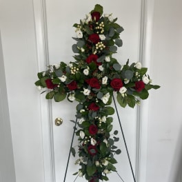 Cross-shaped floral standing spray with red and white roses