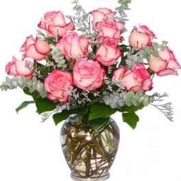 Pink roses arranged in a glass vase