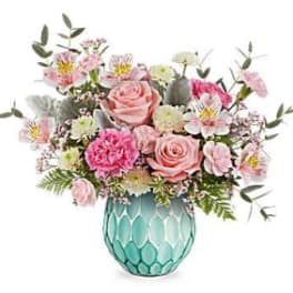 Pink and white mixed bouquet in a turquoise glass vase