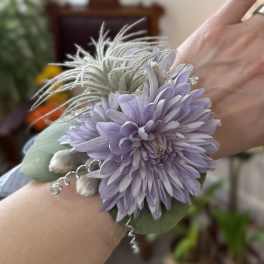 Lavender flower wrist corsage with a large bloom and silver accents