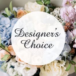 Mixed pastel flower bouquet with a "Designer’s Choice" sign