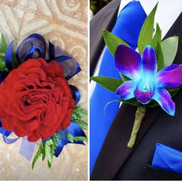 Red rose boutonniere with blue ribbon and green accents, plus a purple orchid boutonniere on a suit lapel