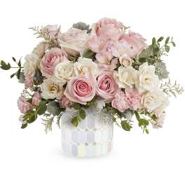 Pink and white rose bouquet in a mosaic ceramic vase