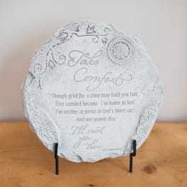 Decorative memorial plaque on a stand with the words "Take Comfort"