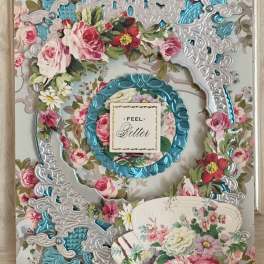 Floral greeting card with ornate silver and blue die-cut layers