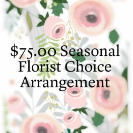 Seasonal florist choice arrangement with pink flowers and green foliage