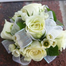 White rose bouquet with small white filler flowers and sheer ribbon
