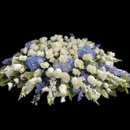 Large white and blue floral casket spray
