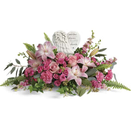 Pink lilies and roses arranged with an angel heart memorial plaque