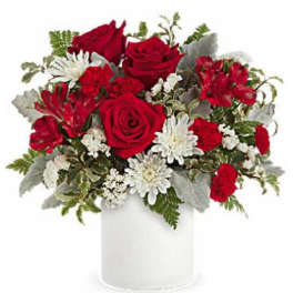 Red roses and white daisies in a white vase