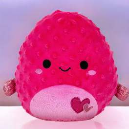 Bright pink heart-themed plush character toy with a smiling face and textured body.