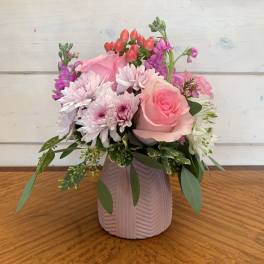 Pink and white mixed bouquet in a ribbed vase