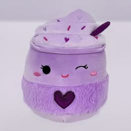 Lavender cupcake-shaped plush toy with a winking face, heart detail, and sprinkle-topped swirl.