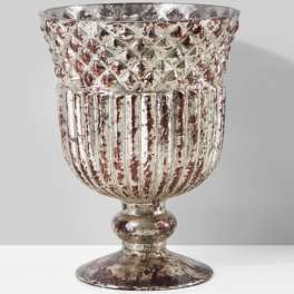 Decorative silver-toned metal urn with a textured, distressed finish